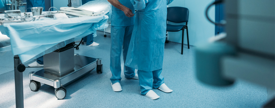 surgeon and nurse preparing for operation